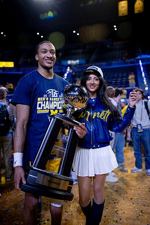 Nimari Burnett (4) and Big Ten Championship Trophy