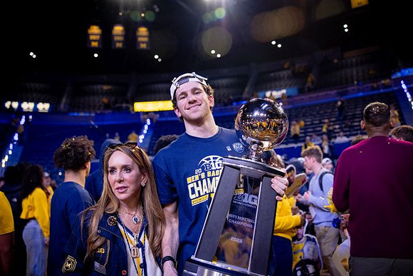 Michigan Player and Big Ten Championship Trophy