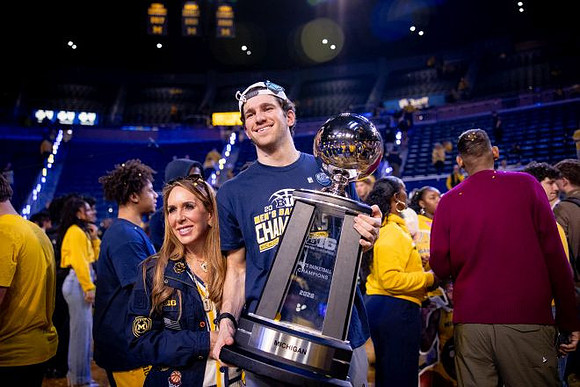 Michigan Player and Big Ten Championship Trophy