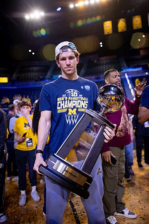 Michigan Player and Big Ten Championship Trophy