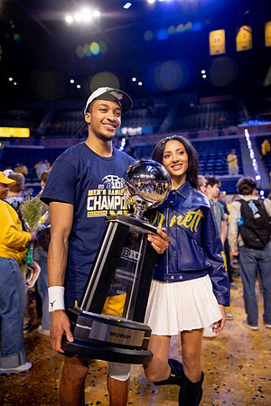 Nimari Burnett (4) and Big Ten Championship Trophy