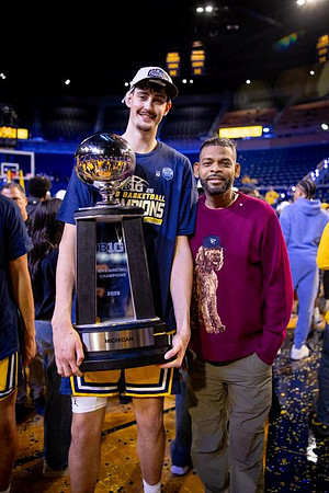 Aday Mara (15) and Big Ten Championship Trophy