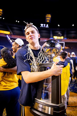 Will Tschetter (42) and Big Ten Championship Trophy