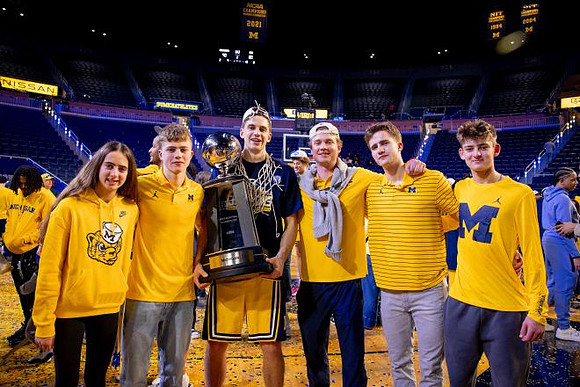 Will Tschetter (42) and Big Ten Championship Trophy