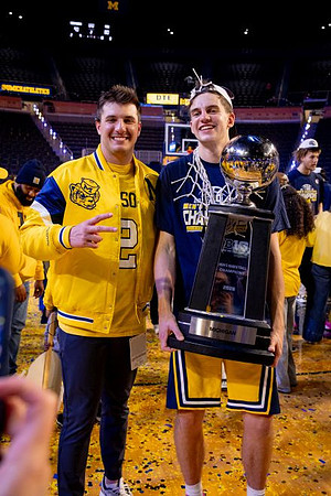 Will Tschetter (42) and Big Ten Championship Trophy