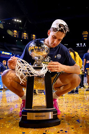 Will Tschetter (42) and Big Ten Championship Trophy