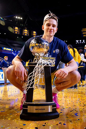 Will Tschetter (42) and Big Ten Championship Trophy