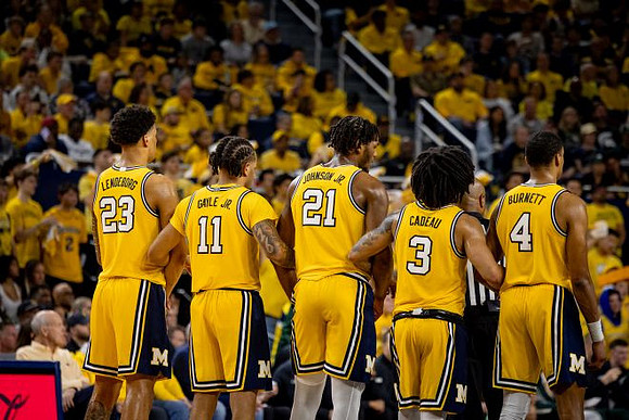 Yaxel Lendeborg (23), Roddy Gayle Jr. (11), Morez Johnson Jr. (21), Elliot Cadeau (3), and Nimari Burnett (4)