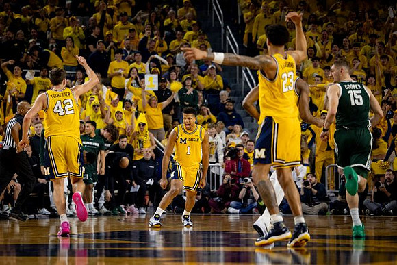 Will Tschetter (42), Trey McKenney (1), and Yaxel Lendeborg (23)