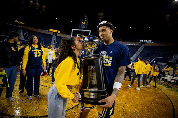 Yaxel Lendeborg (23) and Big Ten Championship Trophy