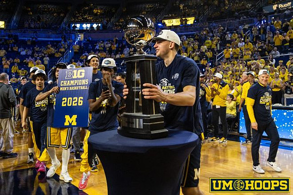Will Tschetter (42), Dusty May, Michigan Team, and Big Ten Championship Trophy