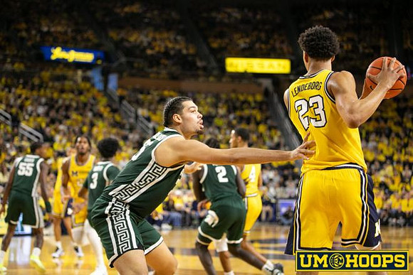 Morez Johnson Jr. (21), Nimari Burnett (4), and Yaxel Lendeborg (23)