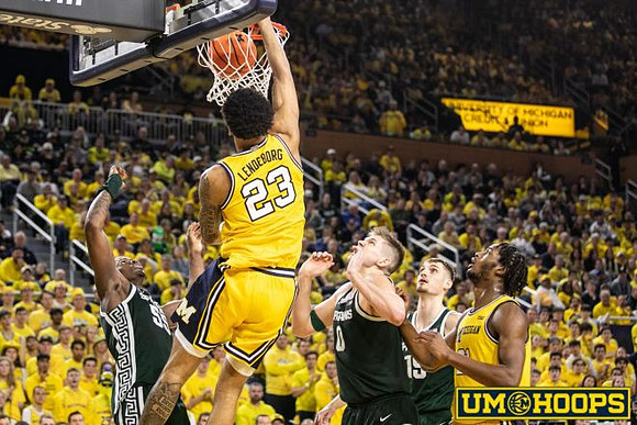 Yaxel Lendeborg (23) and Morez Johnson Jr. (21)