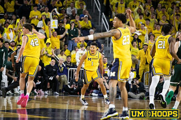 Will Tschetter (42), Trey McKenney (1), Yaxel Lendeborg (23), and Morez Johnson Jr. (21)