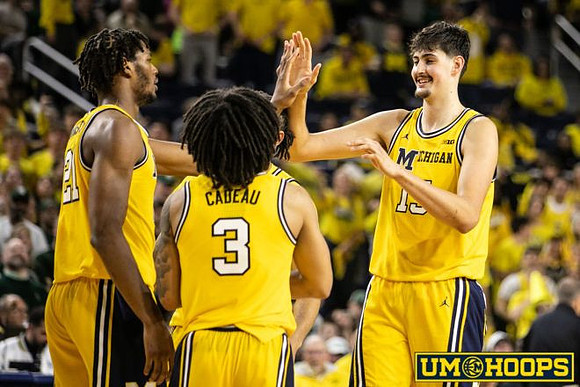Morez Johnson Jr. (21), Elliot Cadeau (3), and Aday Mara (15)