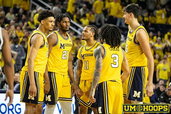 Yaxel Lendeborg (23), Morez Johnson Jr. (21), Roddy Gayle Jr. (11), Elliot Cadeau (3), and Aday Mara (15)