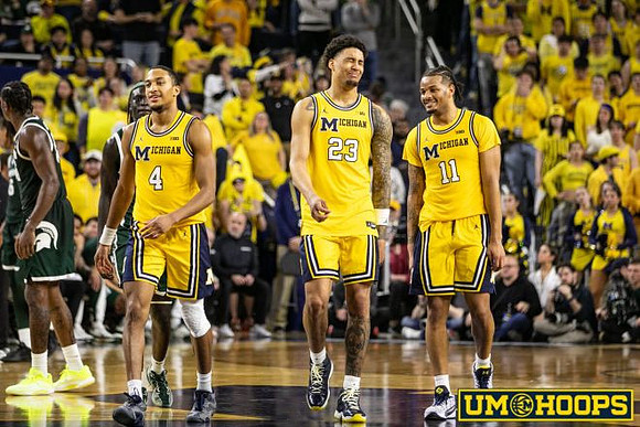 Nimari Burnett (4), Yaxel Lendeborg (23), and Roddy Gayle Jr. (11)