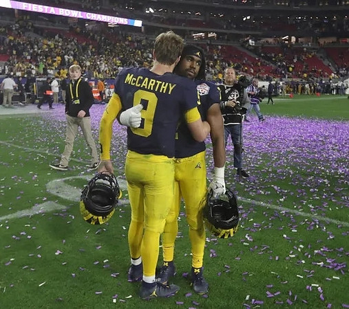 J.J. McCarthy (9) and Donovan Edwards (7)