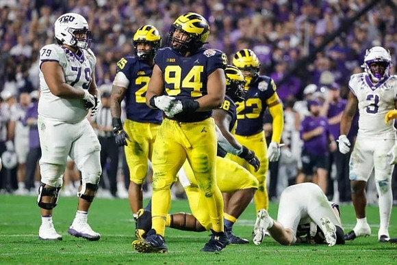 Junior Colson (25), Kris Jenkins (94), Mazi Smith (58), and Michael Barrett (23)
