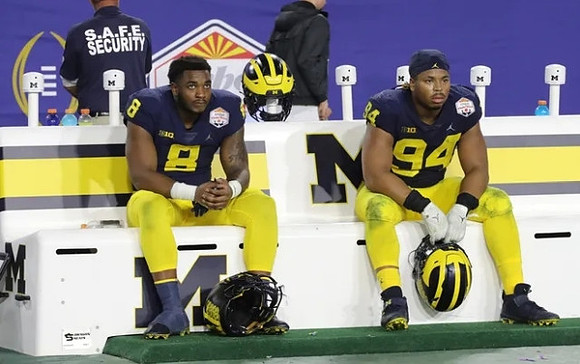 Derrick Moore (8) and Kris Jenkins (94)