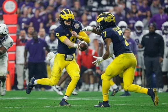 J.J. McCarthy (9) and Donovan Edwards (7)