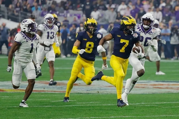 J.J. McCarthy (9) and Donovan Edwards (7)
