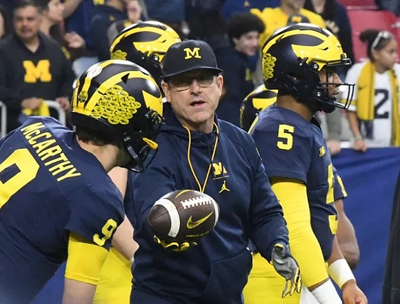 J.J. McCarthy (9), Jim Harbaugh, and Brandon Mann (5)