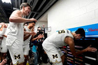 Aday Mara (15) and Michigan Team