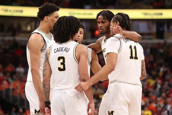 Yaxel Lendeborg (23), Elliot Cadeau (3), Trey McKenney (1), Morez Johnson Jr. (21), and Roddy Gayle Jr. (11)