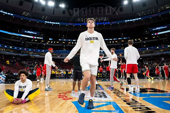 Will Tschetter (42) and Michigan Team