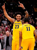 Yaxel Lendeborg (23) and Roddy Gayle Jr. (11)