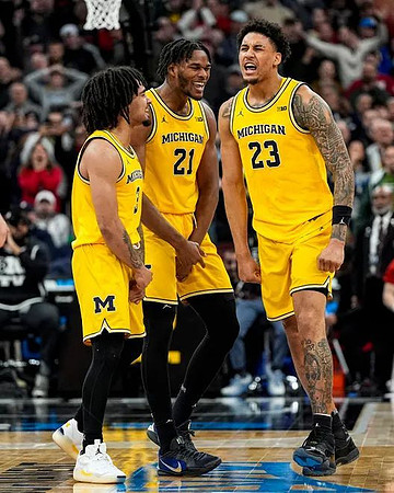 Elliot Cadeau (3), Morez Johnson Jr. (21), and Yaxel Lendeborg (23)
