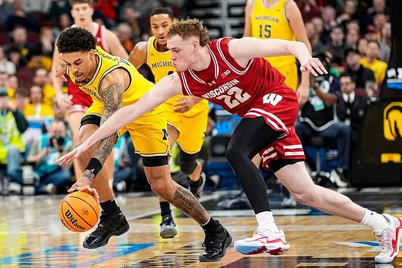 Yaxel Lendeborg (23), Nimari Burnett (4), and Aday Mara (15)