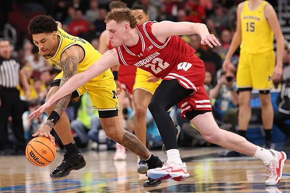Yaxel Lendeborg (23), Nimari Burnett (4), and Aday Mara (15)