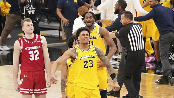 Yaxel Lendeborg (23), Elliot Cadeau (3), and Morez Johnson Jr. (21)