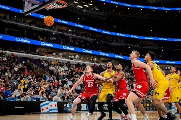 Morez Johnson Jr. (21), Yaxel Lendeborg (23), and Trey McKenney (1)