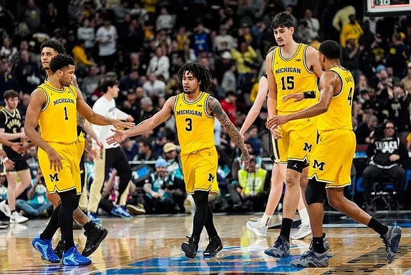 Yaxel Lendeborg (23), Trey McKenney (1), Elliot Cadeau (3), Aday Mara (15), and Nimari Burnett (4)