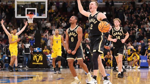 Yaxel Lendeborg (23) and Nimari Burnett (4)