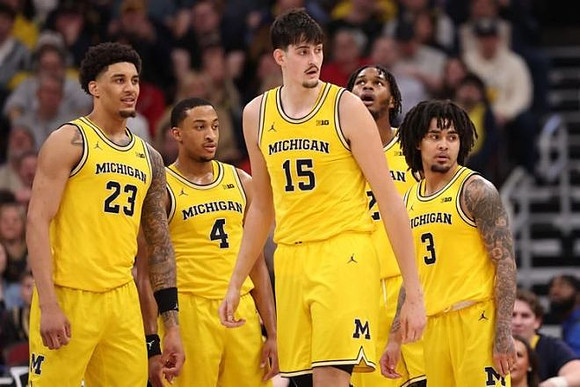 Yaxel Lendeborg (23), Nimari Burnett (4), Aday Mara (15), Morez Johnson Jr. (21), and Elliot Cadeau (3)