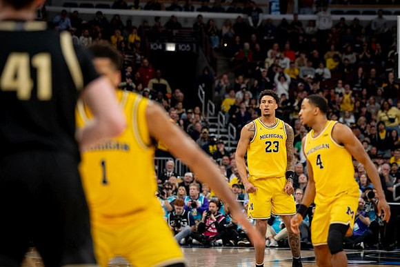 Trey McKenney (1), Yaxel Lendeborg (23), and Nimari Burnett (4)