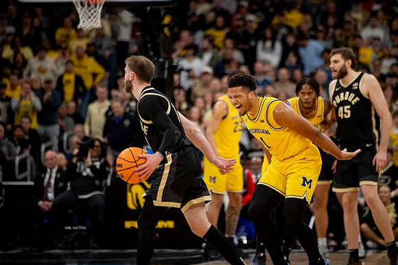 Yaxel Lendeborg (23), Trey McKenney (1), and Morez Johnson Jr. (21)