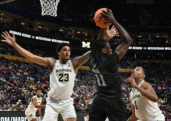 Trey McKenney (1), Yaxel Lendeborg (23), and Nimari Burnett (4)