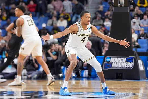 Yaxel Lendeborg (23) and Nimari Burnett (4)