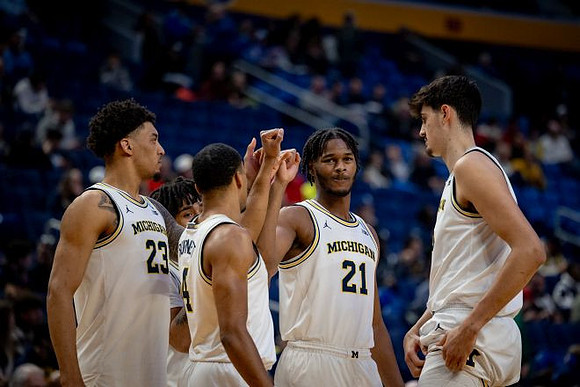 Yaxel Lendeborg (23), Nimari Burnett (4), Morez Johnson Jr. (21), Aday Mara (15), and Elliot Cadeau (3)