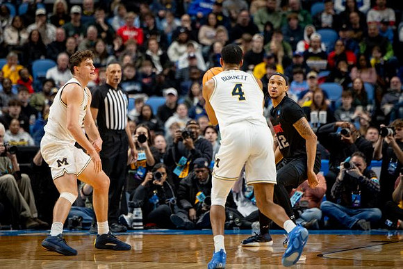 Will Tschetter (42) and Nimari Burnett (4)
