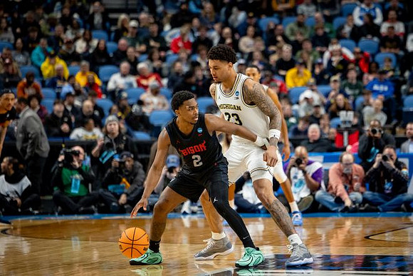 Yaxel Lendeborg (23) and Nimari Burnett (4)