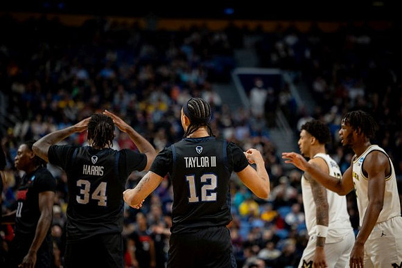 Yaxel Lendeborg (23) and Morez Johnson Jr. (21)