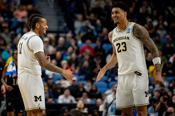 Roddy Gayle Jr. (11) and Yaxel Lendeborg (23)