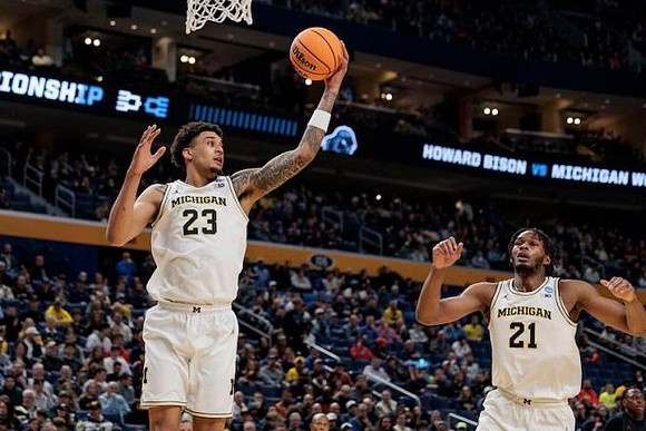Yaxel Lendeborg (23) and Morez Johnson Jr. (21)