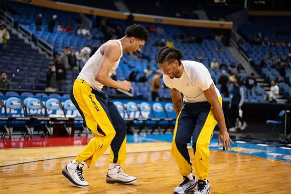 Yaxel Lendeborg (23) and Roddy Gayle Jr. (11)